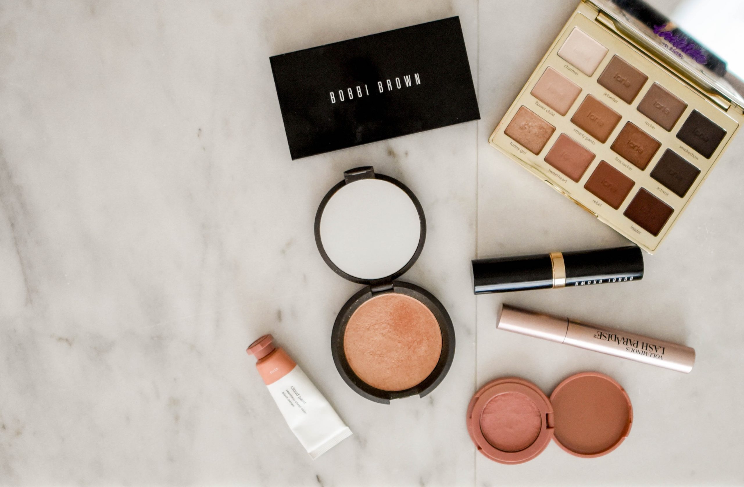 selection of makeup for healthy skin on tabletop