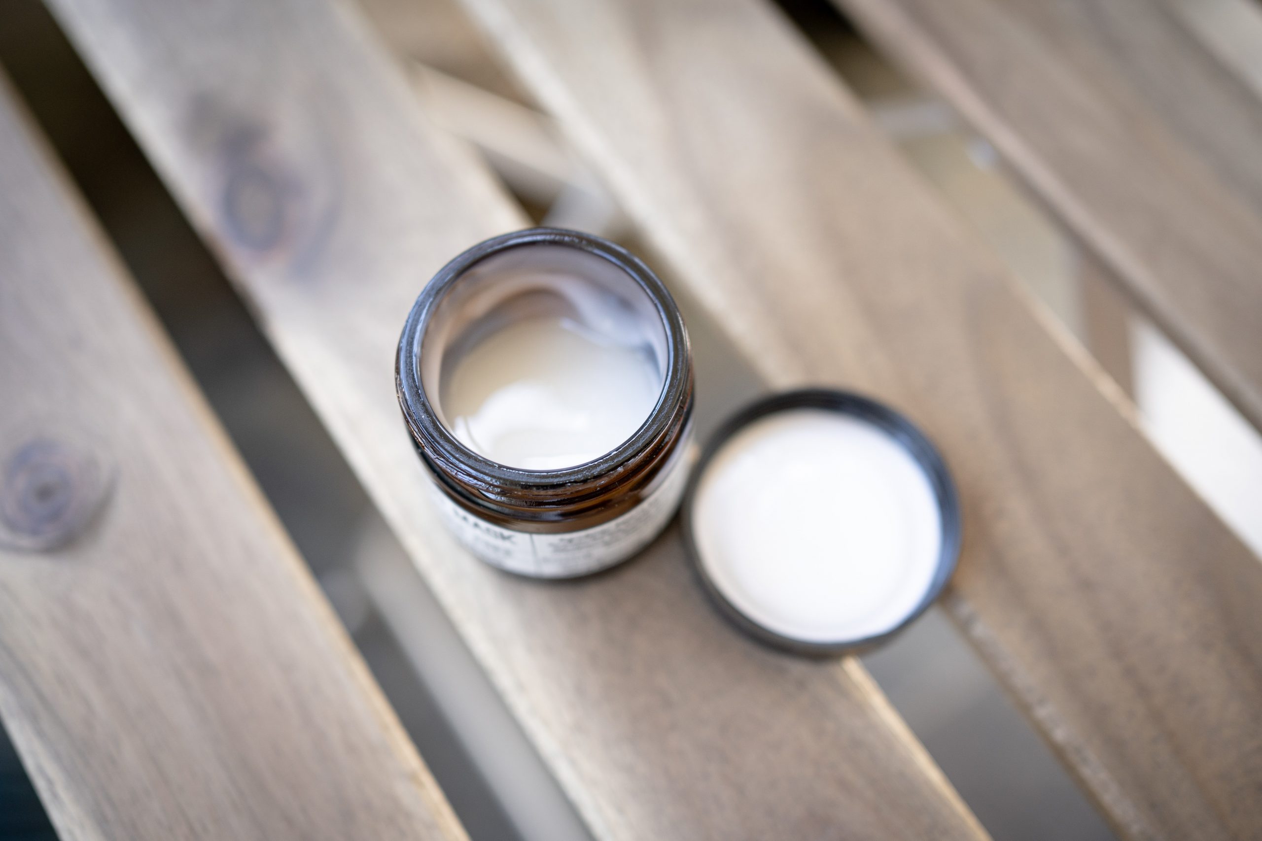 open pot of skin moisturiser on table