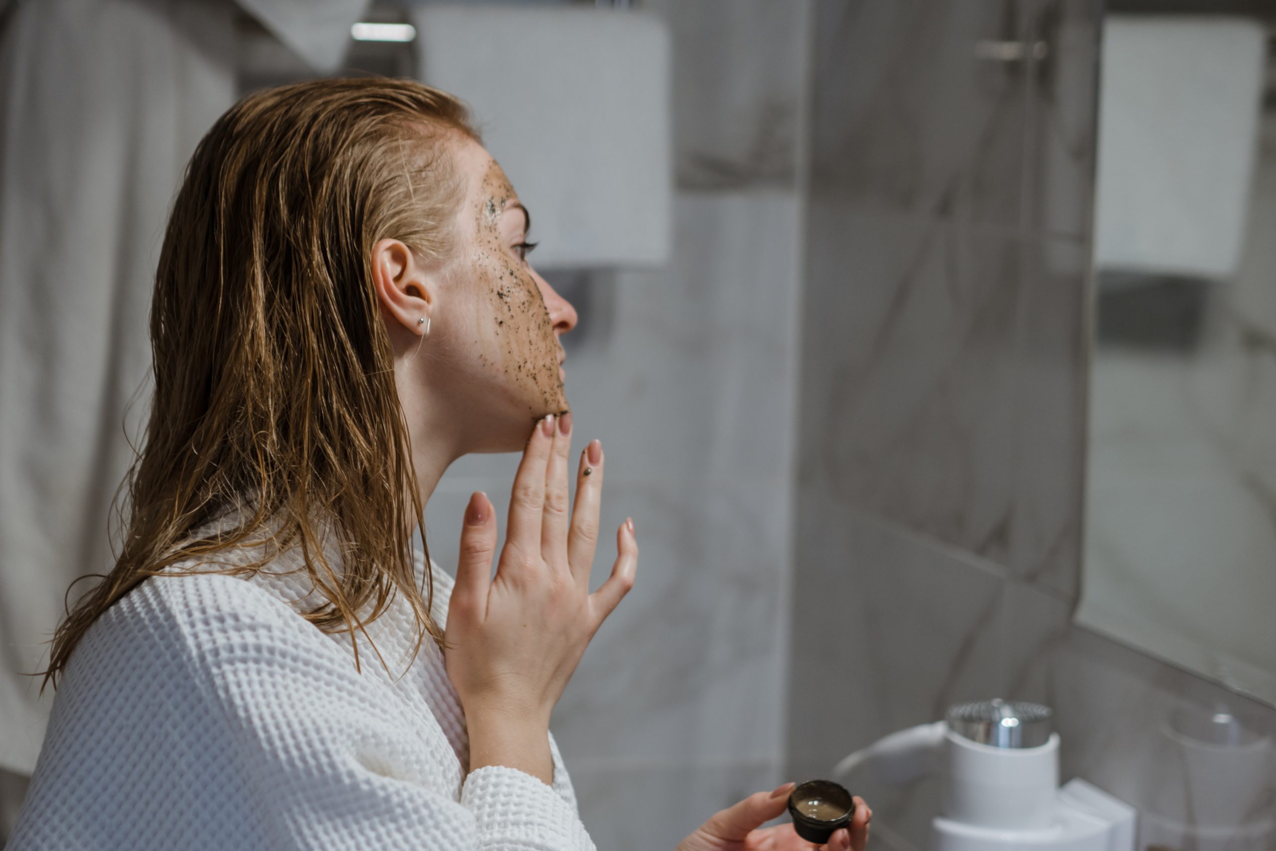 woman applying face mask