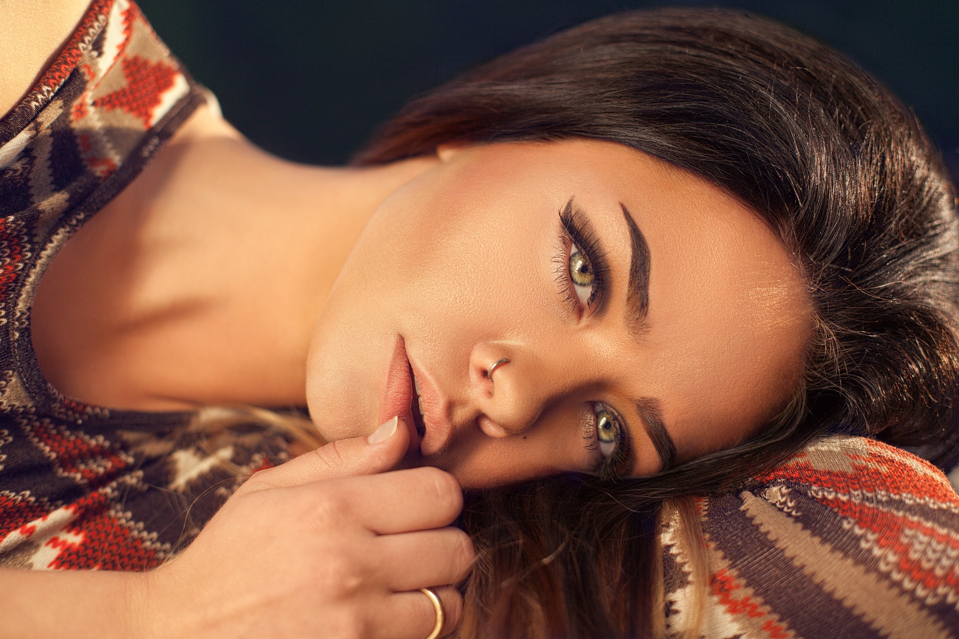 closeup of person's face, lying on her side, nose, dermal fillers lowdown