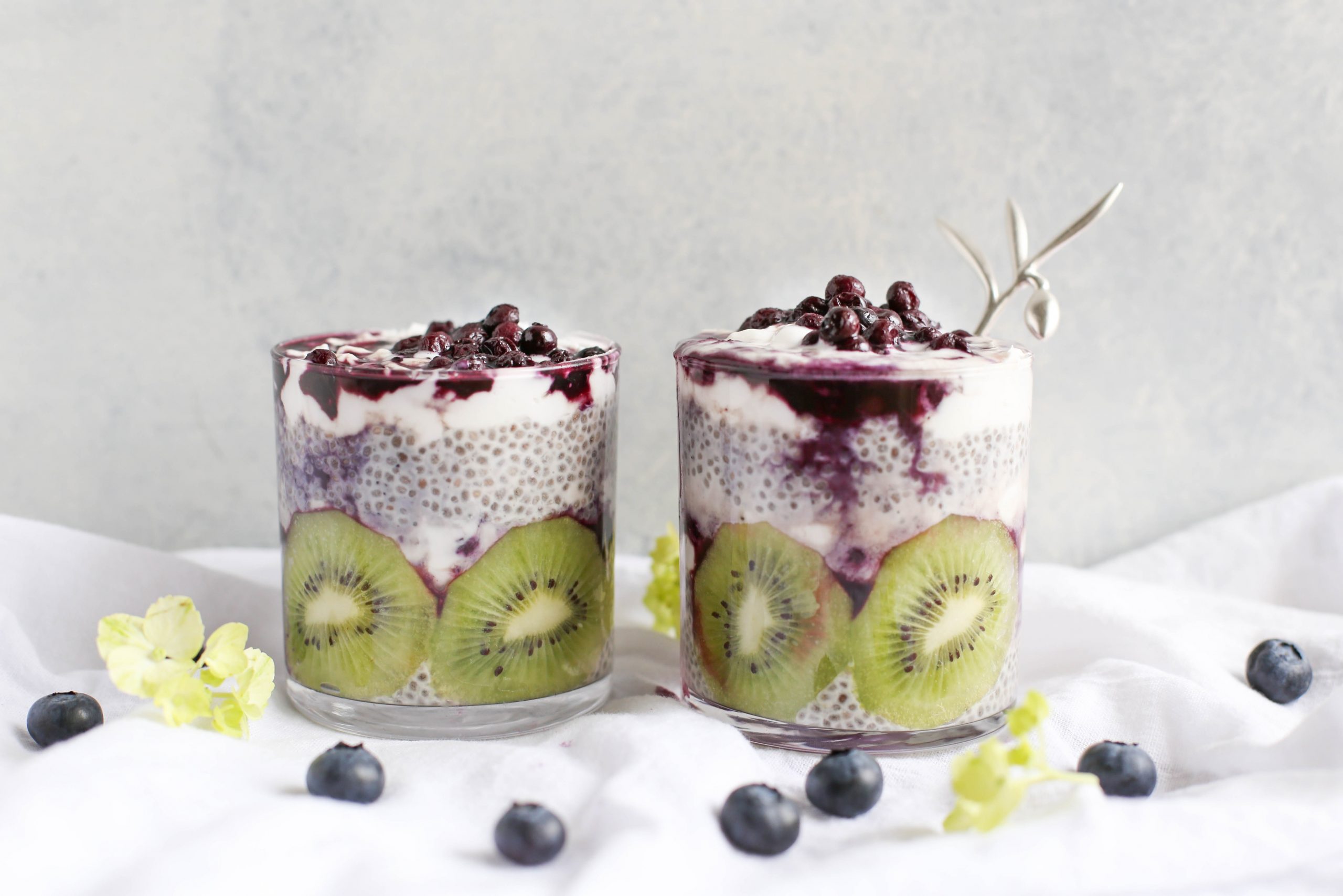 two fruit drinks on white surface