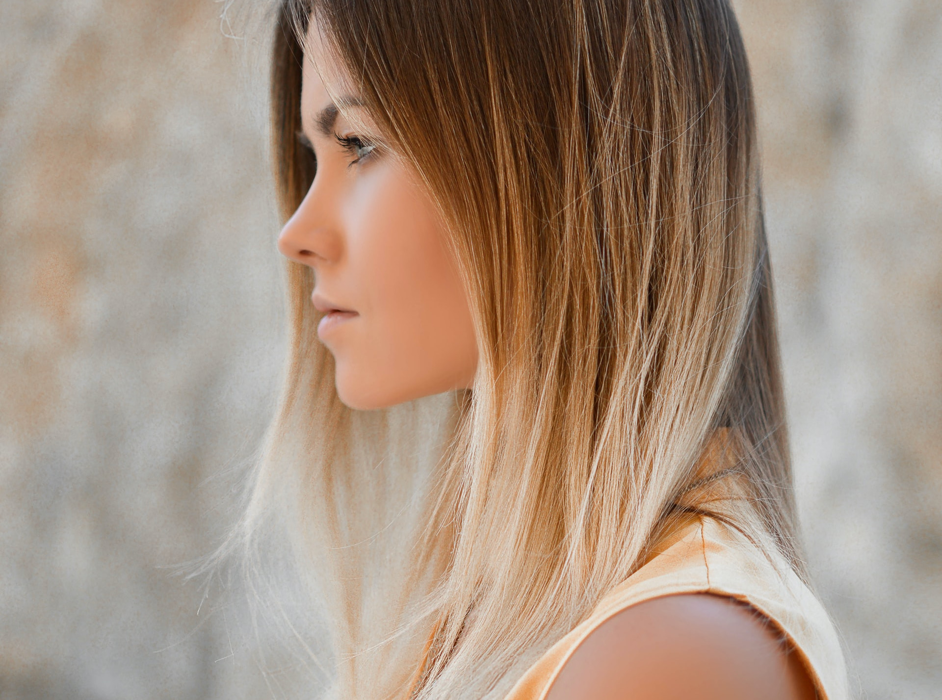 side view of person looking off-camera, smooth skin, pensive face