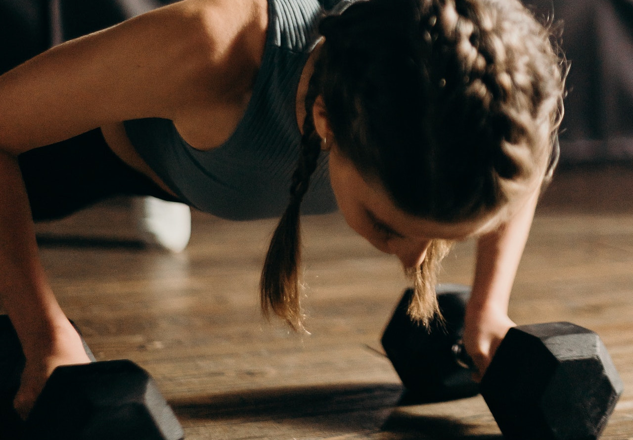 person planking with biceps