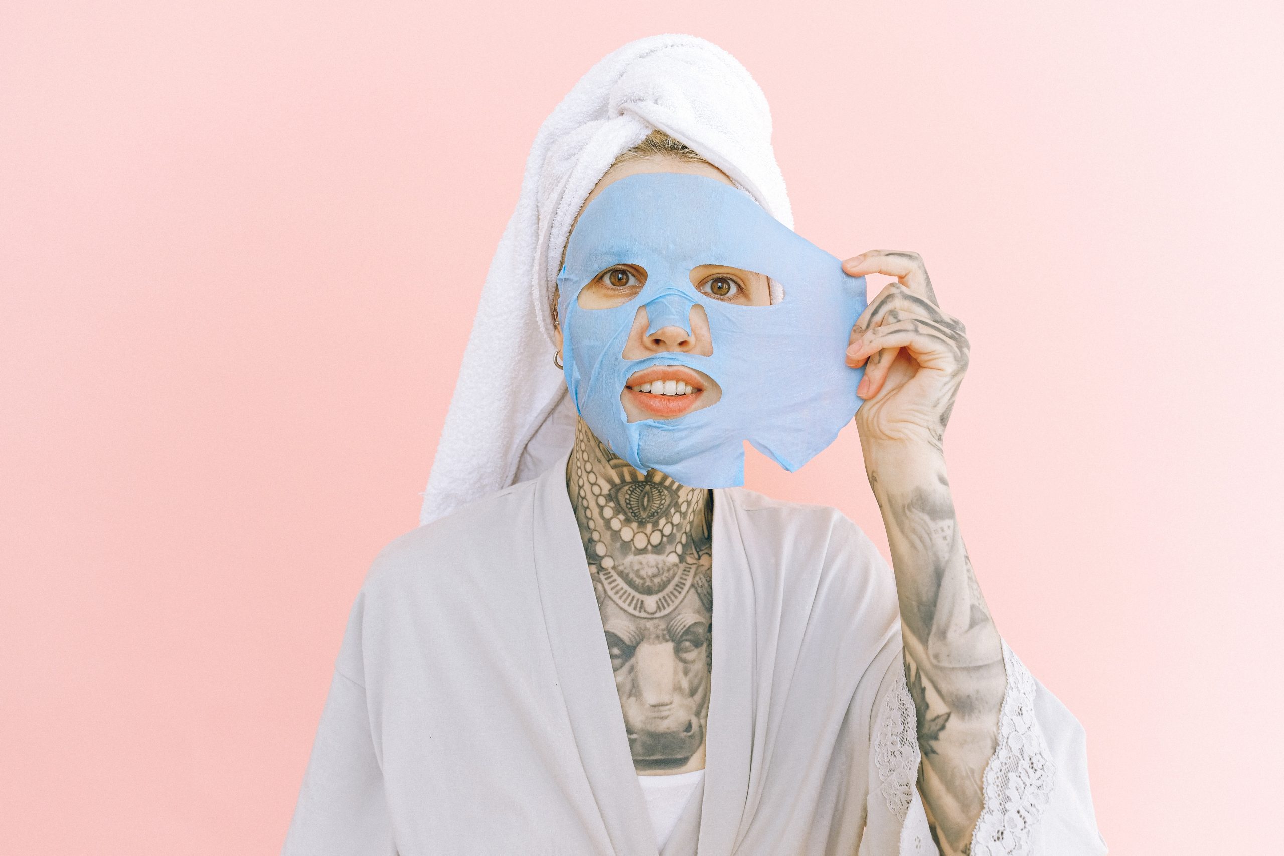 tattooed woman wearing a face mask