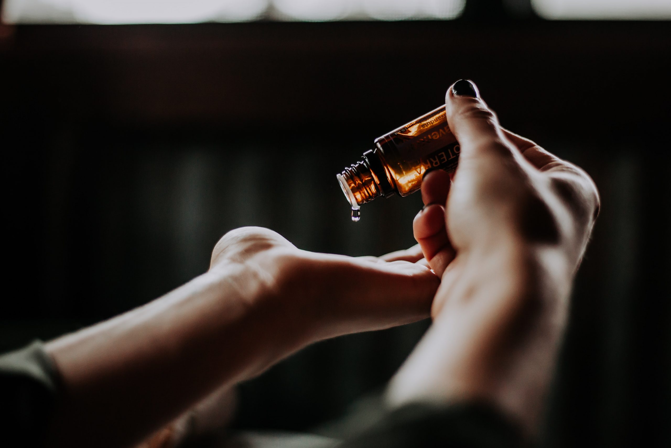 cosmetic product, bottled, dripping onto hand