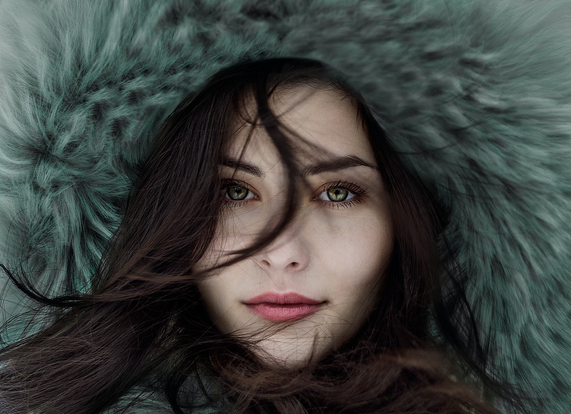 closeup of person's face surrounded by warm winter wear