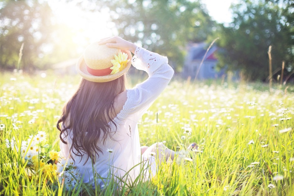 woman in sun wearing hat